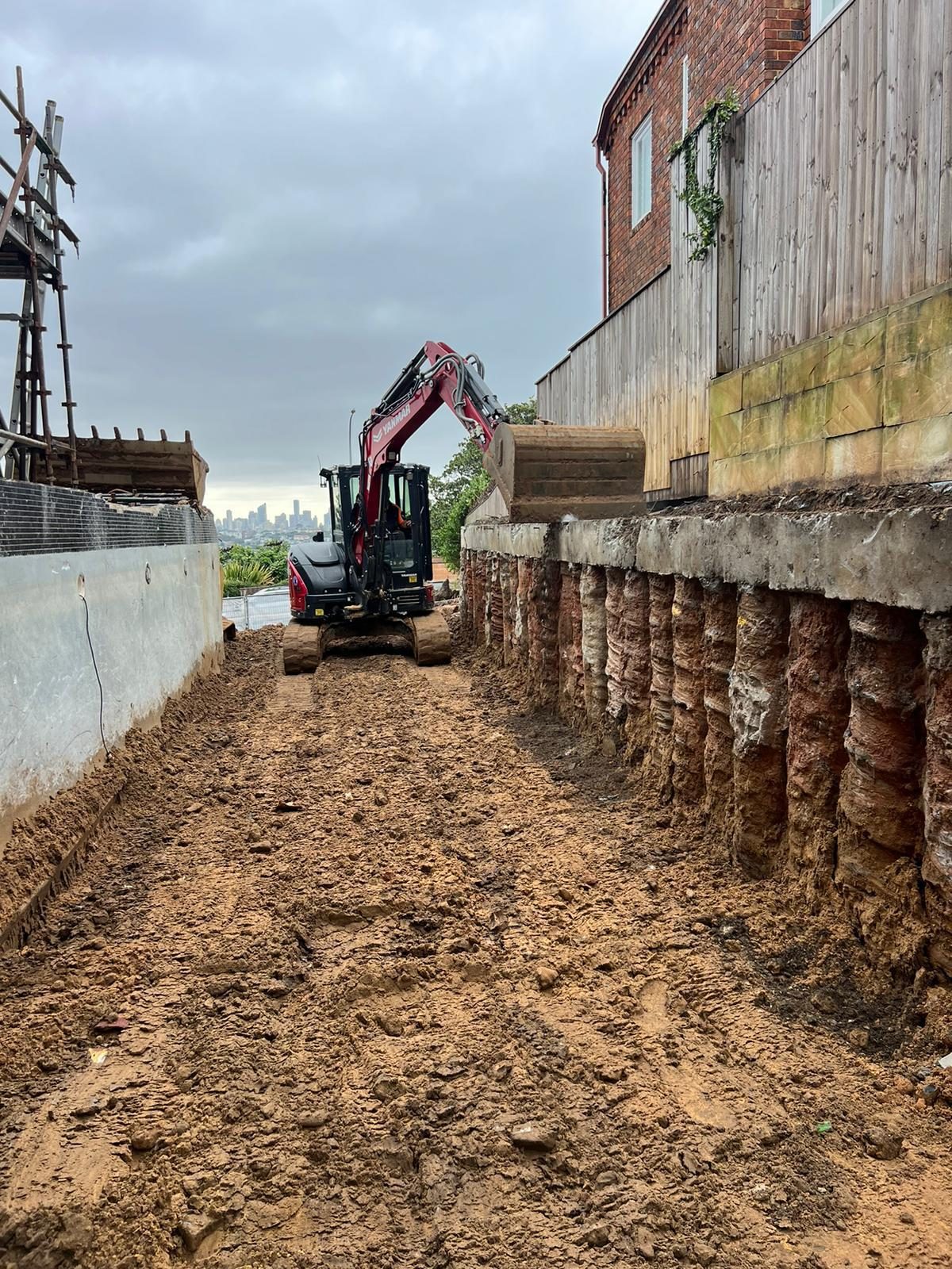 Excavator working on cut